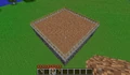 Minecraft Beta中一座普通的掘一死战场馆,使用泥土作为竞技平台,凹洞中填上熔岩。