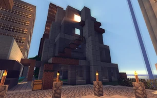 Highrise right in the middle of the downtown area. Started after xexe left by justinjacob and NetherJon about half a year ago. Hasn't been completed yet, with no end in sight. Truth: It was completed but after AJ rolled back the town due to an issue the building went back to its incomplete state.
