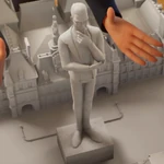 Statuetka projektanta mody na makiecie miasta