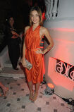 Miranda-Kerr-brightened-up-draped-orange-halter-dress-during