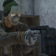 A player holding the 9mm Handgun.