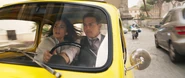 Ethan and Grace speeding through Rome in a Fiat 500.