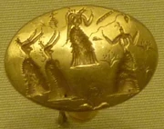 Anillo de oro de la tumba de Isopata, cerca de Cnosos, Creta, 1400-1500 a.C. Mostrándose figuras femeninas bailando entre la vegetación en floración; Museo Arqueológico de Heraclión