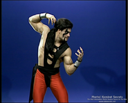 Turk performing a prototype versus pose of Shang Tsung in MK3.