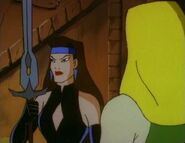 Princess Kitana holds one of the Swords of Ilkan.