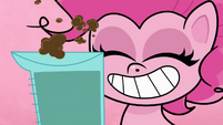 Pinkie smiling next to measuring cup PLS1E1a