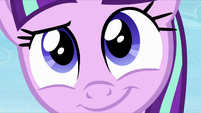 An extreme close-up of Starlight smiling S5E26