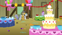Pinkie Pie's family looking at the party decorations S1E23