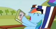 Rainbow Dash with her Daring Do book S03E03