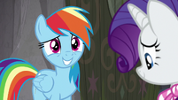 Rainbow smiling apologetically at Rarity S8E17