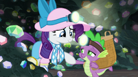 Spike tenderly holding Rarity's hoof S9E19