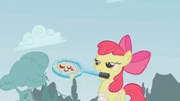 Apple Bloom smiling with tennis racket S1E12