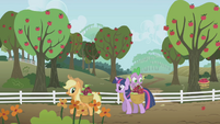 Twilight helping Applejack with the farm.