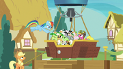 Rainbow Dash tosses cats into the balloon S8E5