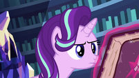 Starlight Glimmer looking at the friendship journal S7E14