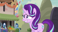 Starlight enters the village with a nervous grin S6E25