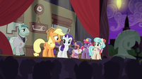 Applejack on stage talking to the audience S5E16