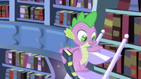 Twilight using magic to pull book from Spike's hand S1E01