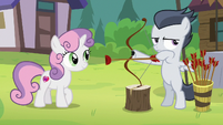 Rumble holding a bow and arrow S7E21