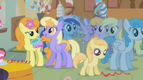 Silver Spoon and Diamond Tiara, behind all the ponies.
