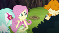 Fluttershy looks over at a gopher hole EG4