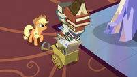 Applejack looking at tall stack of photo albums S6E21