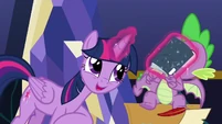 Twilight Sparkle chooses to shove the comic into her handy Spike-ventory!