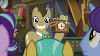 Dr. Hooves grinning and holding up a clock S9E20