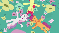 Adult Crusaders lying in field of flowers S9E22