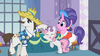 Rarity's father, Sweetie Belle, and Rarity's mother.