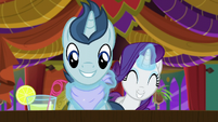 Rarity tying bib around polo pony's neck S6E12