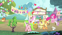 Pinkie Pie hopping while Applejack is pulling a wagon S4E14