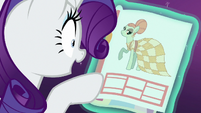 Rarity looking at the dress picture S6E21