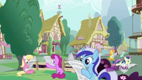 Ponies reading the newspaper.