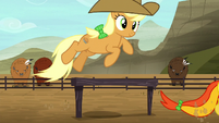 Brown rodeo mare jumping over hurdle S5E6