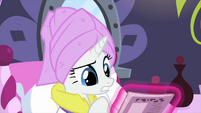 Rarity looking at magazine cover MLPS1