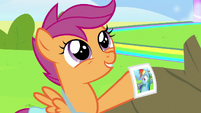 Scootaloo holding Rainbow's newest photo S7E7