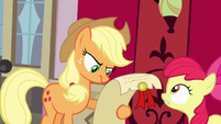 Applejack looking at scroll S4E09