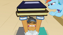 Quibble Pants lifting two books S9E6