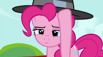 Pinkie Pie putting her hat on S4E21