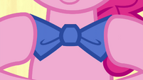 Pinkie Pie putting on a bow tie S4E22