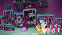 Ponies look at creatures in cages S8E26