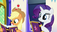 Applejack and Rarity with copies of the journal S7E14