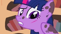 Twilight thinks this is first sign of the future, while Spike thinks it's just a normal papercut.