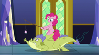 Pinkie leading Sludge with cupcake and stick S8E24