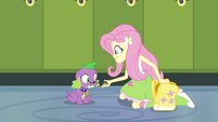 Fluttershy feeds Spike a dog biscuit EG