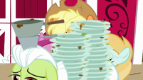 Granny Smith carries dirty dishes past Applejack S7E14