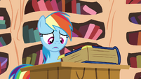 Rainbow looking at the book S4E21