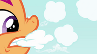 Scootaloo biting a cloud.