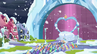 Applejack, Fluttershy, and Rainbow in front of the Crystal Empire crowd S6E2